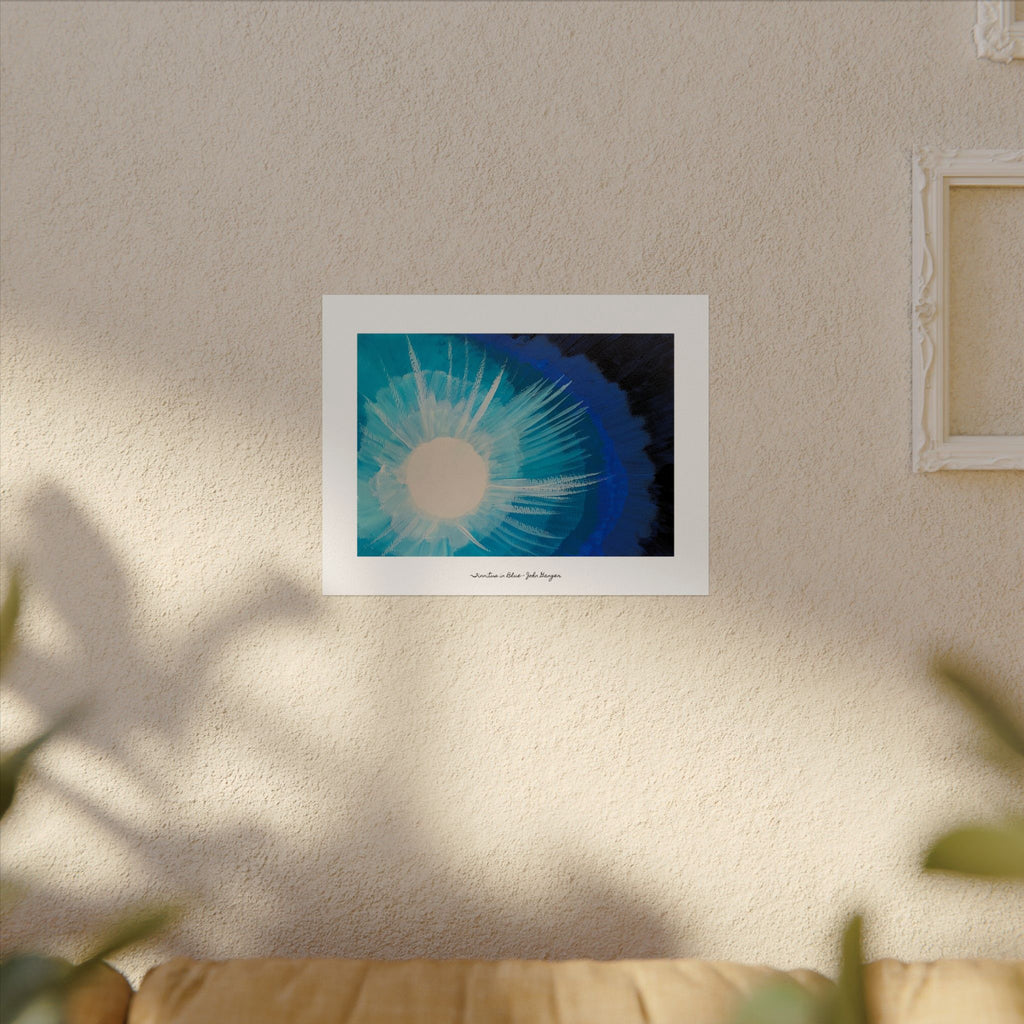 Framed artwork of a blue and white abstract design on a beige wall.