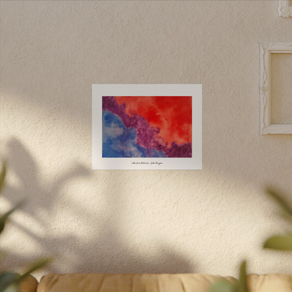 Framed abstract artwork with red and blue hues on a beige wall. "The Line Between"